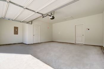 an empty room with white walls and white doors